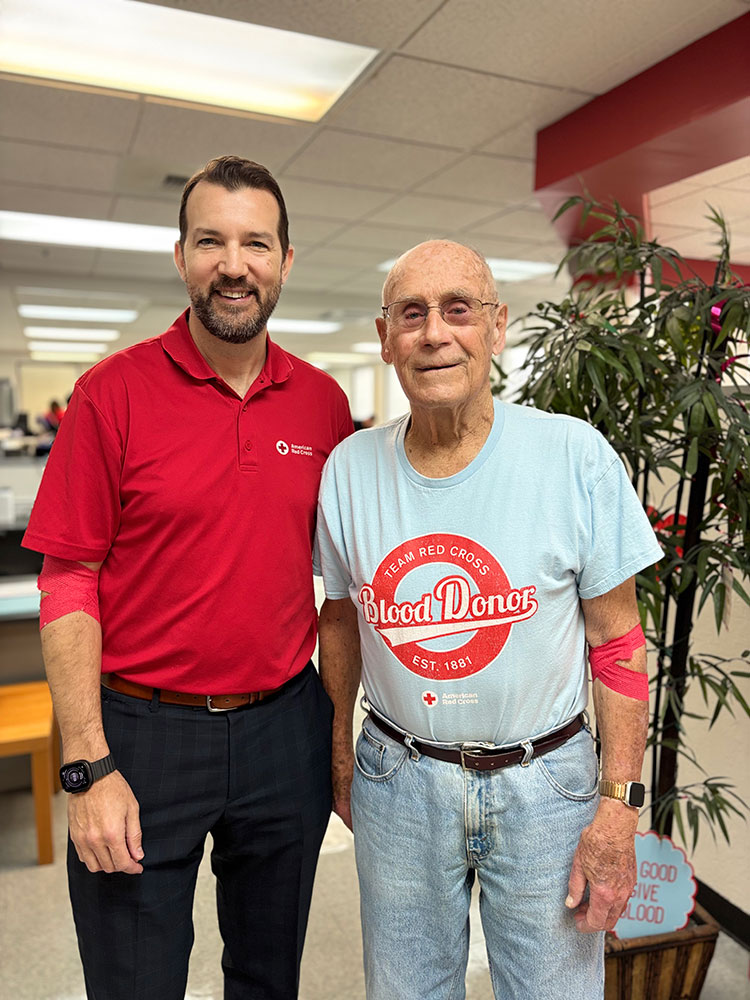 Fred Sullivan standing next to Justin Mueller, Regional CEO.