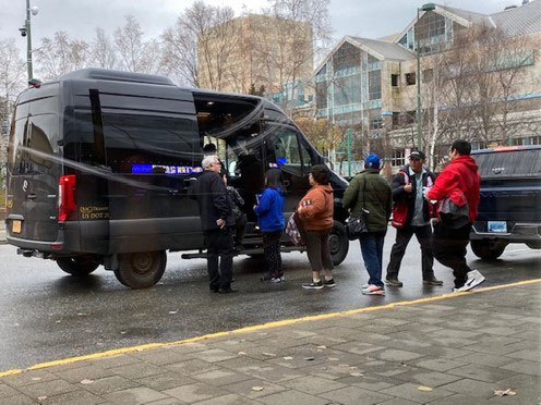 Alaska shelter residents getting into a van.