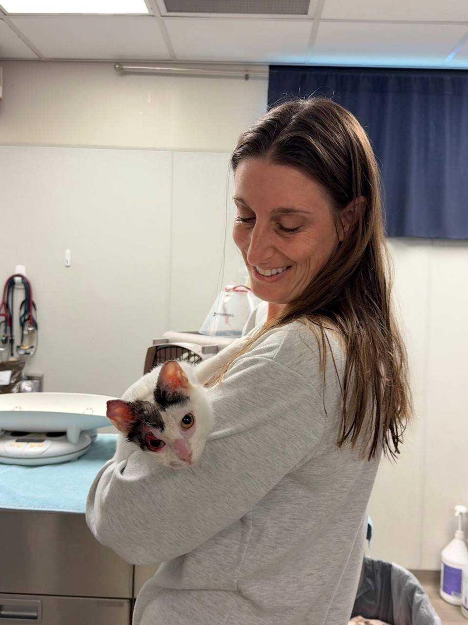Jessica holding a cat.