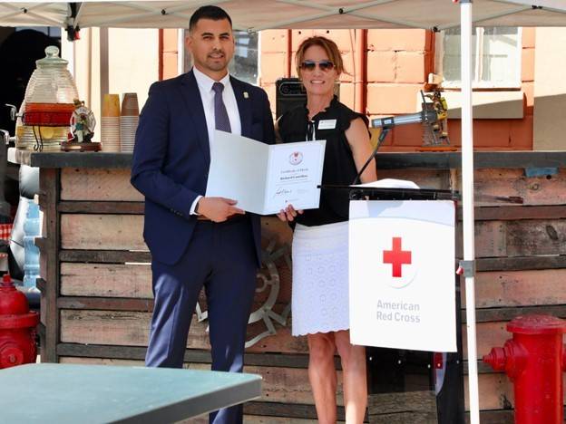 Off-duty police officer Richard Castellon with Central Coast Chapter Executive director and Interim Regional CEO Michele Averill.