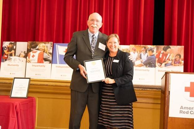 Patrick McKenna (left) receiving his award from Silicon Valley Chapter Executive director, Reagan Lund (right)