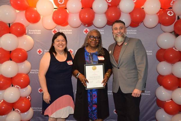 Vanessa Brown (middle) receiving her award from Sr. Community Disaster Program manager, Debbie Yee (left), and North Bay Executive director, Vincent Valenzuela (right)