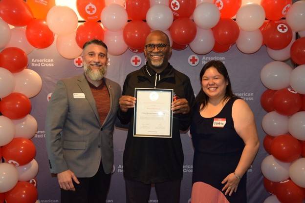 Darryl McCullough (middle) receiving his award from Sr. Community Disaster Program manager, Debbie Yee (right), and North Bay Executive director, Vincent Valenzuela (left