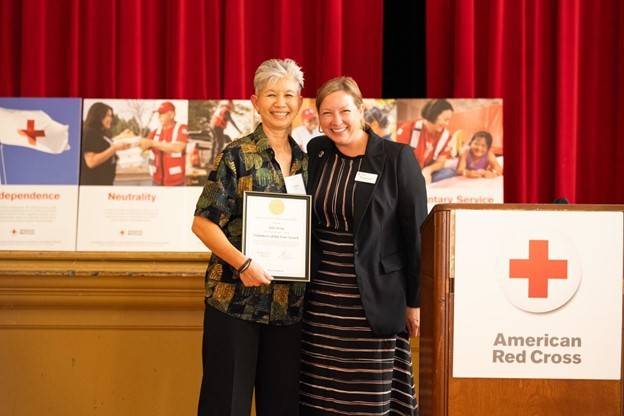 Julia Wong (left) receiving his award from Silicon Valley Chapter Executive director, Reagan Lund (right)