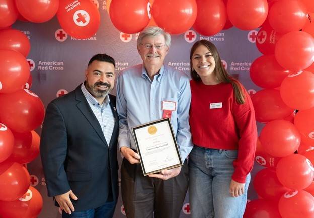 Art Webb (middle) receiving his award from Regional CEO, Hanna Malak (left), and Regional Mass Care manager, Natalie Manier (right)