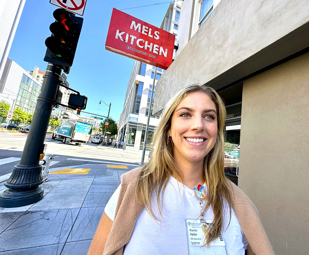 Rachel Heller outside of Mel’s Kitchen on a sunny day.