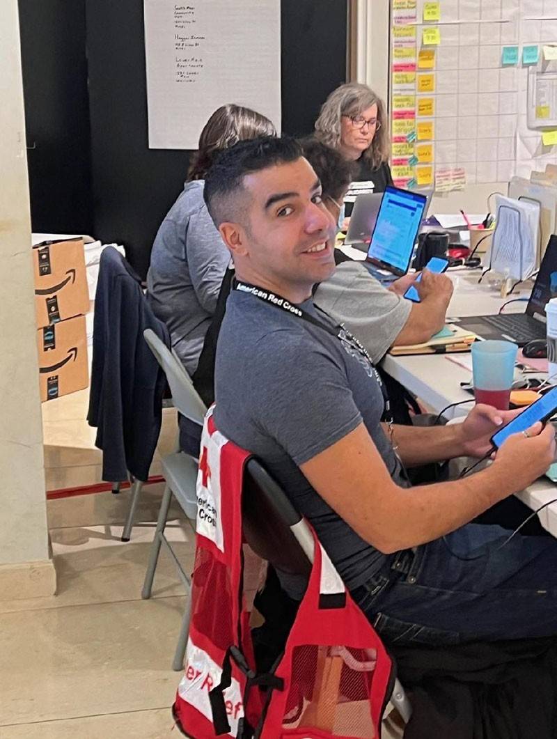 Farshad Fallah sitting in chair at the Disaster headquarters on Maui.