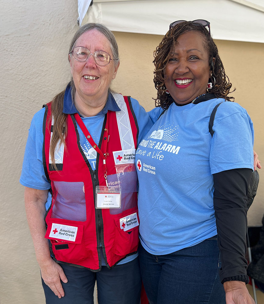 Red Cross volunteers Susan Reese and Brenda Thomas smile for picture.
