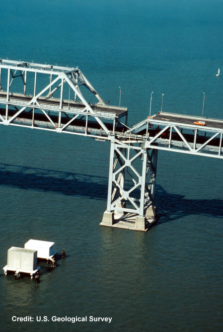 Bridge over water that has been damaged by an earthquake.