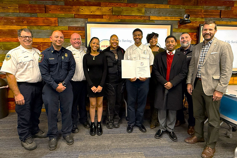 Group pic of Vincent Valenzuela, his family, girlfriend and fire deprtment.
