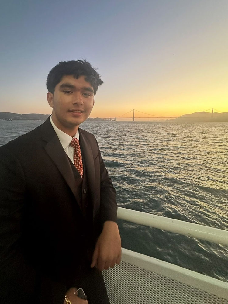Amarjot Toor enjoys a sunset view of the bay and Golden Gate Bridge.