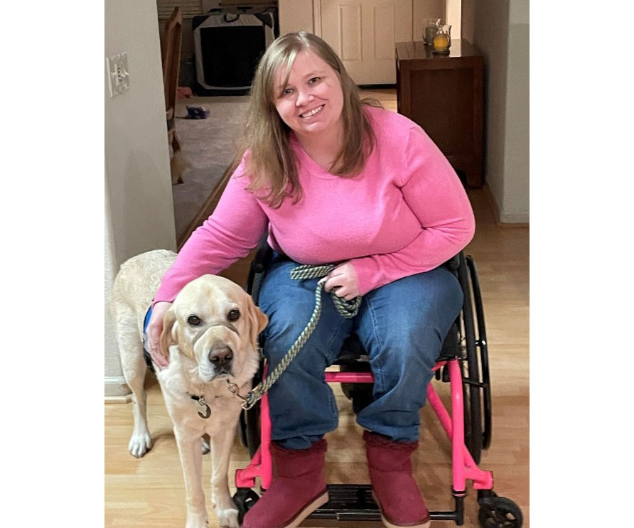 Caitlin Cox and Fritz, her service dog.