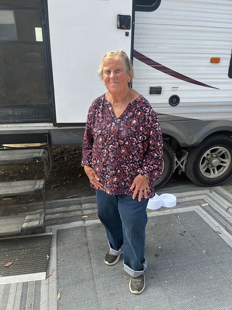 Joanne Jackson standing next to her trailer.
