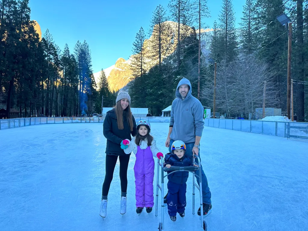 justin and family at outdoor ice skating 