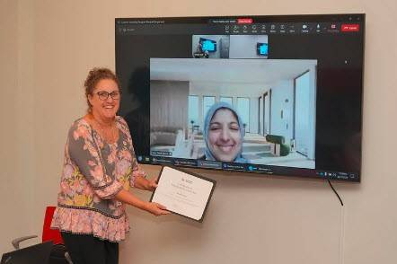 Red Cross intern Zainab Khan virtually receiving her internship completion certificate.