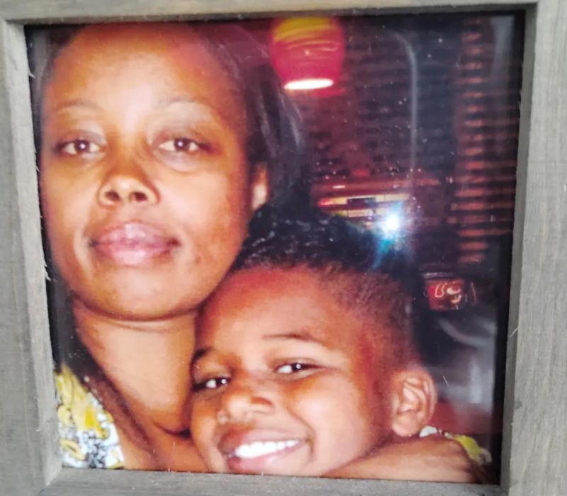 woman embracing young boy