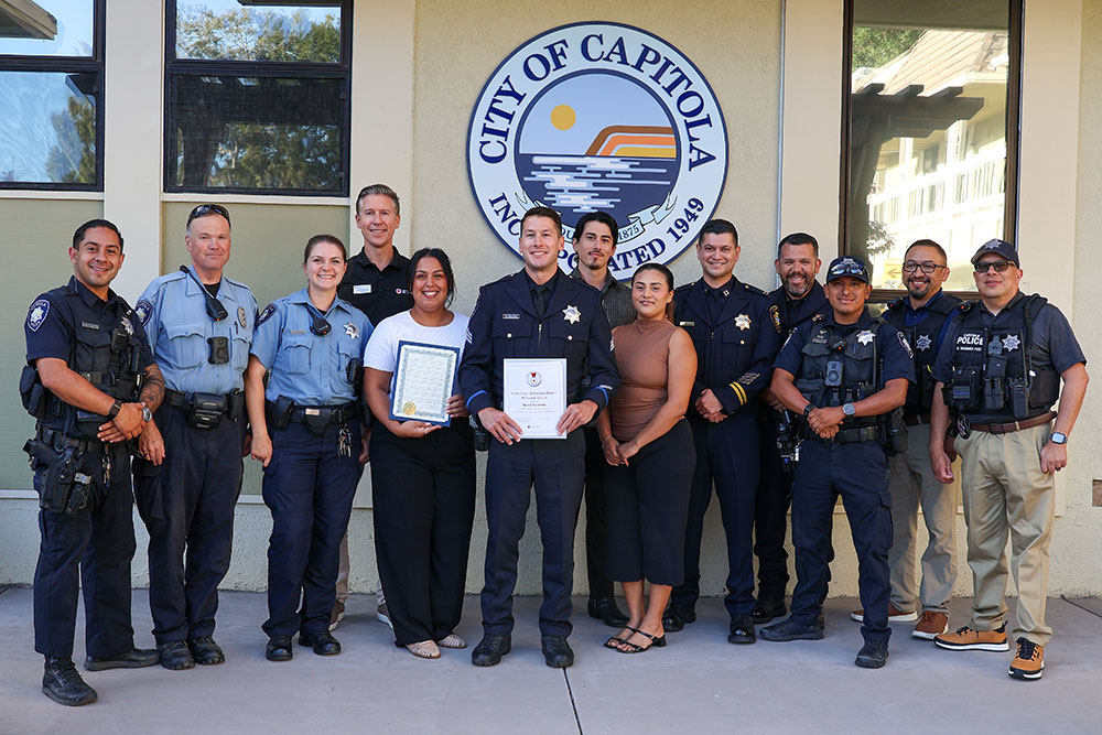 Capitola Police members and Capitola Police Sgt. Scott Newton holding a Red Cross award at a Capitola City Council meeting.