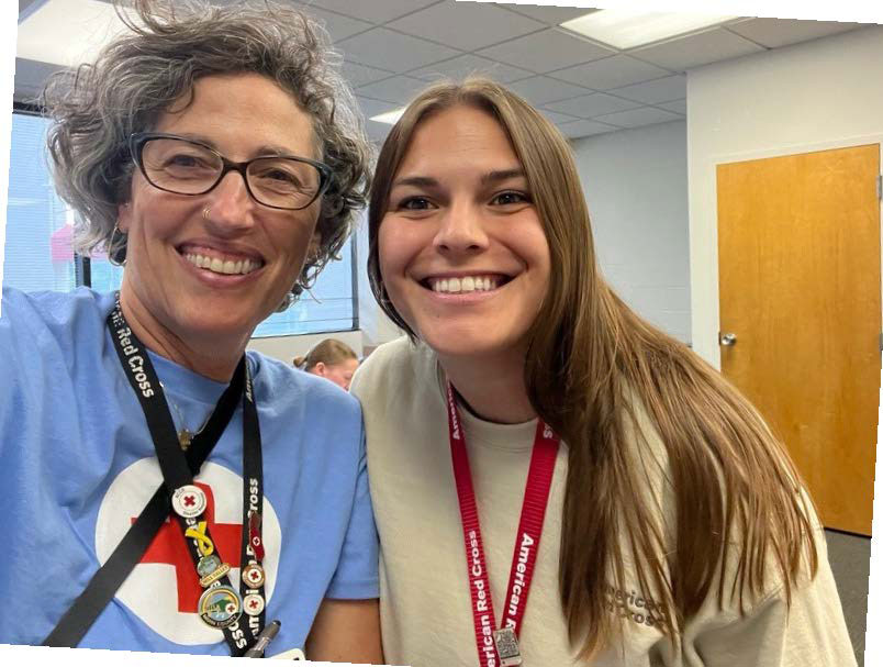 Manager Natalie Manier and Lyra Kelly smile for picture.