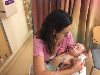 sarah montoya holding her son