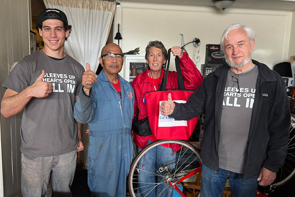 Red Cross volunteers giving a thumbs up.