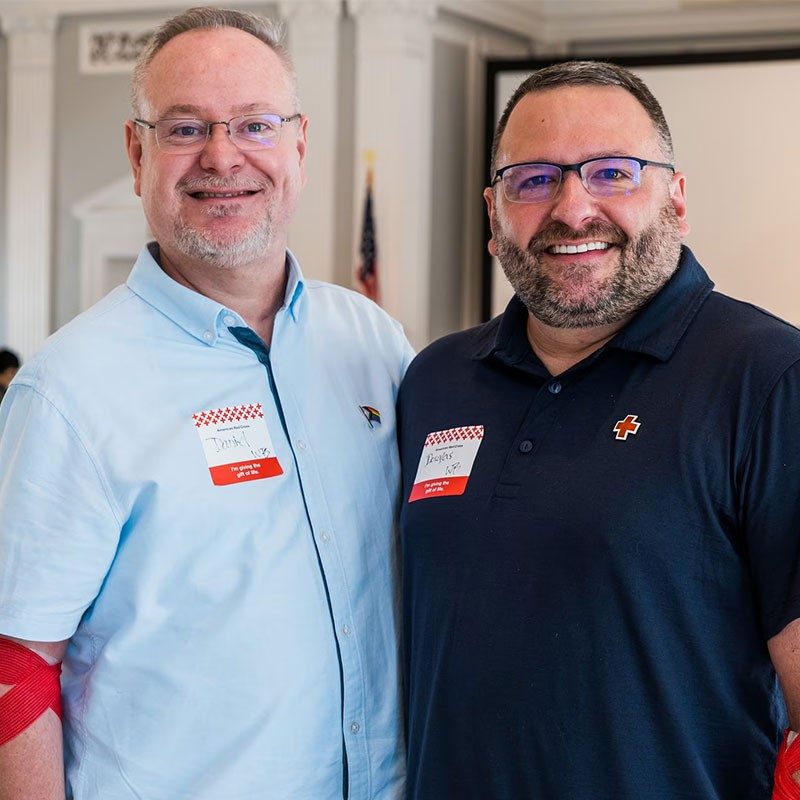 Two men smiling for camera