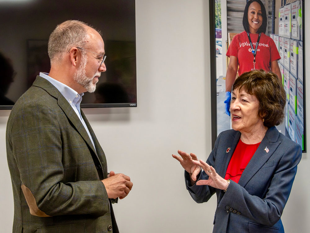 two people talking to each other the newly renovated Red Cross facility in Portland.
