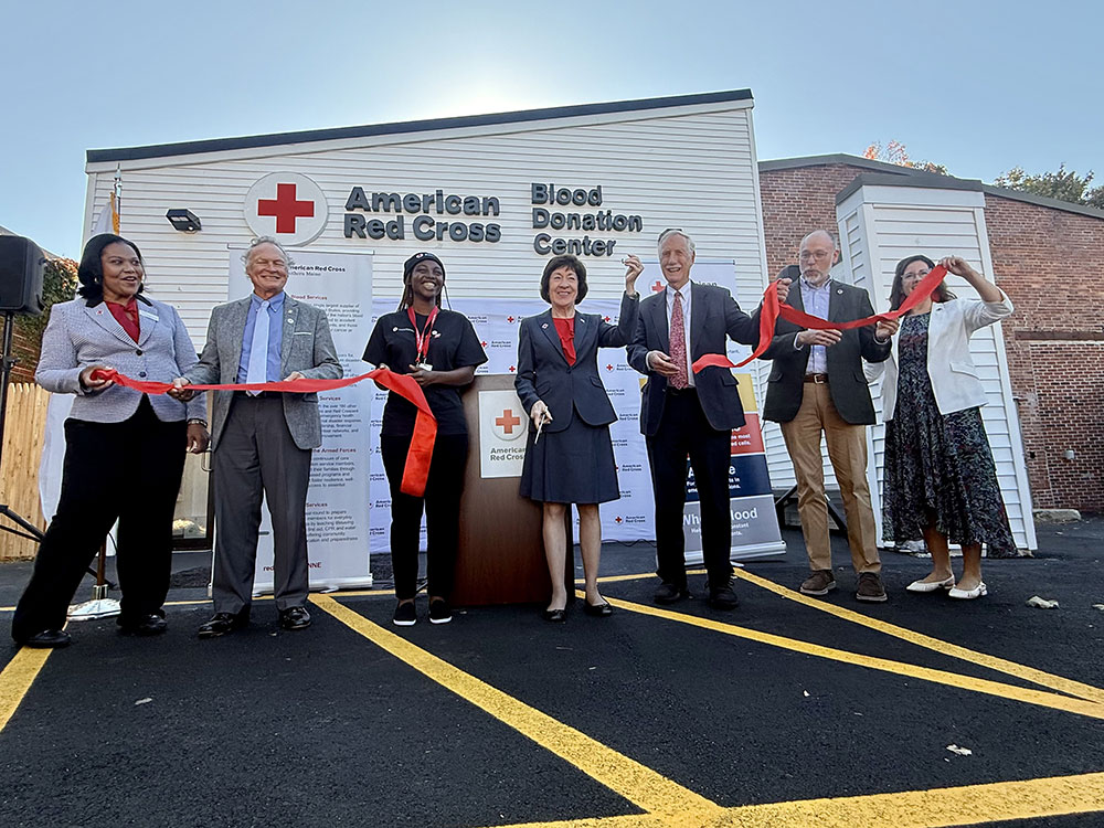 Red Cross staff at a ribbon cutting ceremony.