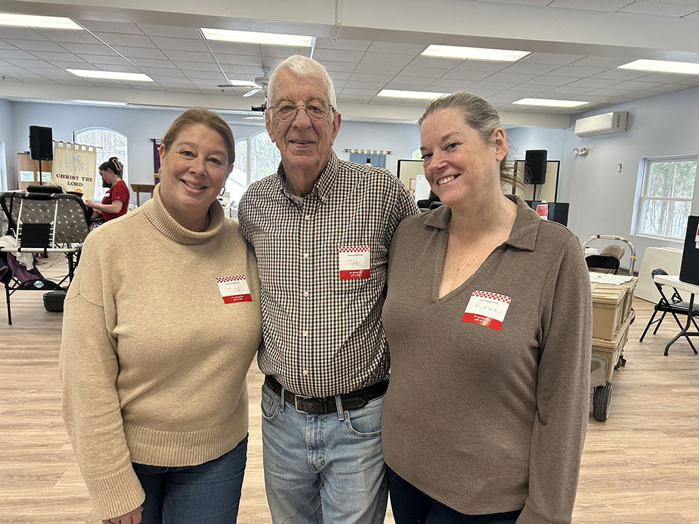 Dori Demaio, John Sigalos, and Karen McLaughlin group photo.