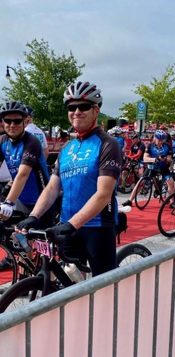 Ed smiling in a bike race