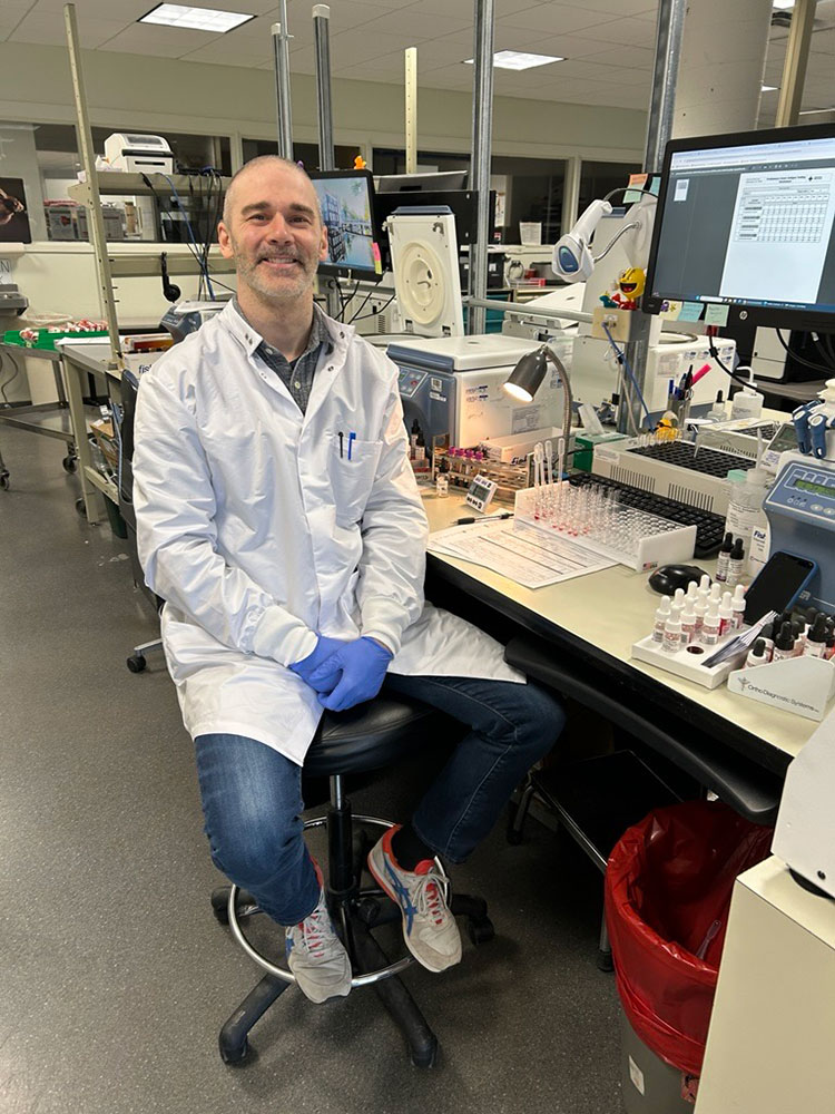 Eric Gunther in a lab smiling for picture.