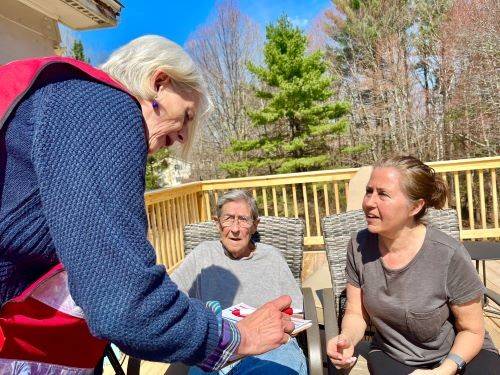 image of three women speaking to each other