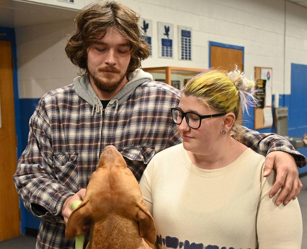 Jacob and Martika Knight petting dog