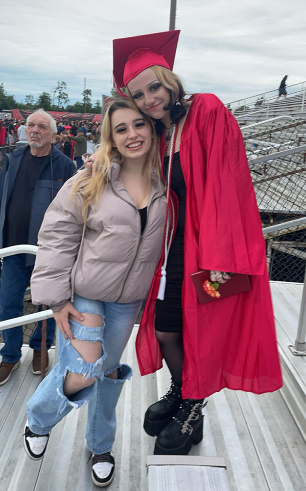 Jade and Mandy Howard hugging each other at a graduation.