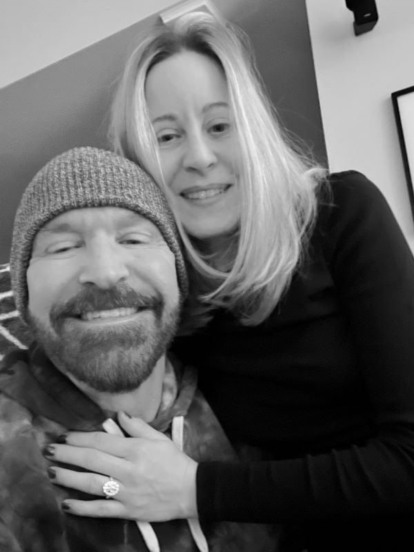 Phillip with his partner smiling