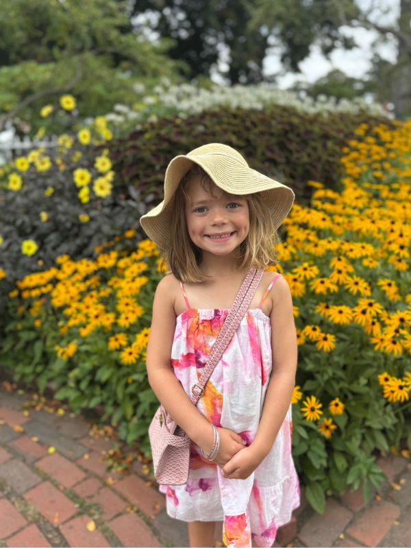 young child smiling in garden