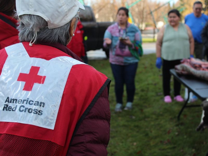 volunteer speaking with civilians