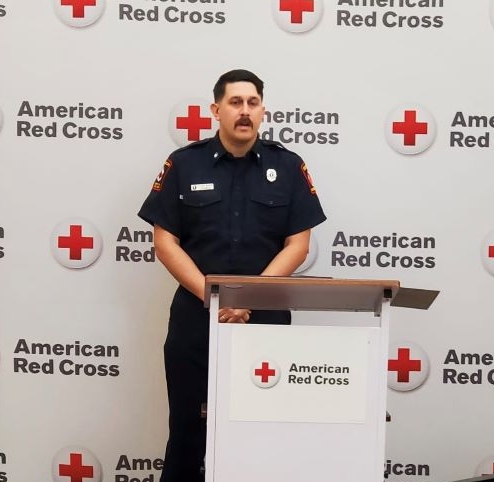 image of man standing at a podium