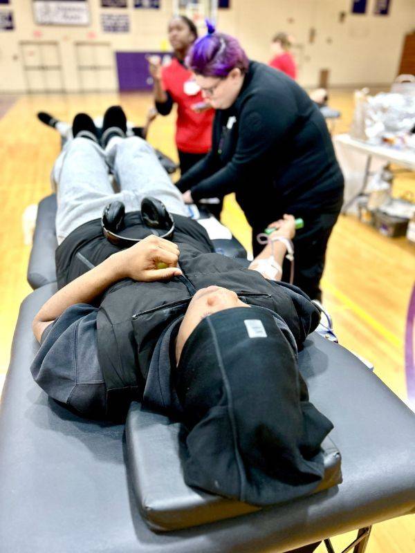 young man donating blood
