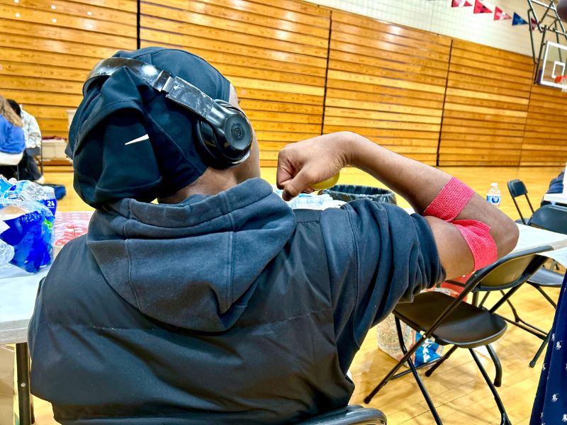 black blood donor rolls up sleep after donating blood