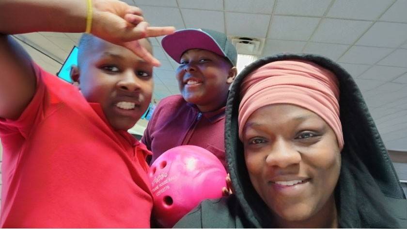 Ashley Jackson, Okikechukwu Emeana, and Chibueze Emeana take a selfie together.