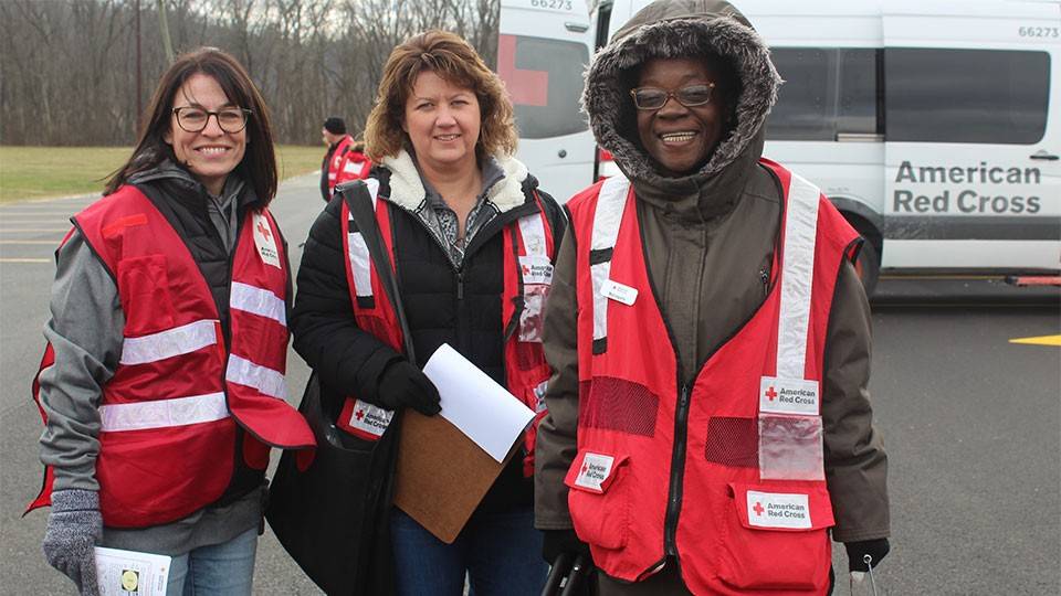 Red Cross volunteers getting ready to install smoke alarms.