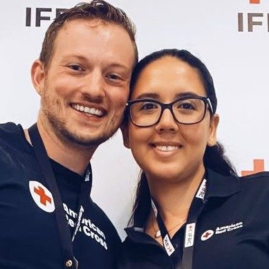 Two Red Cross staffers in Red Cross shirts