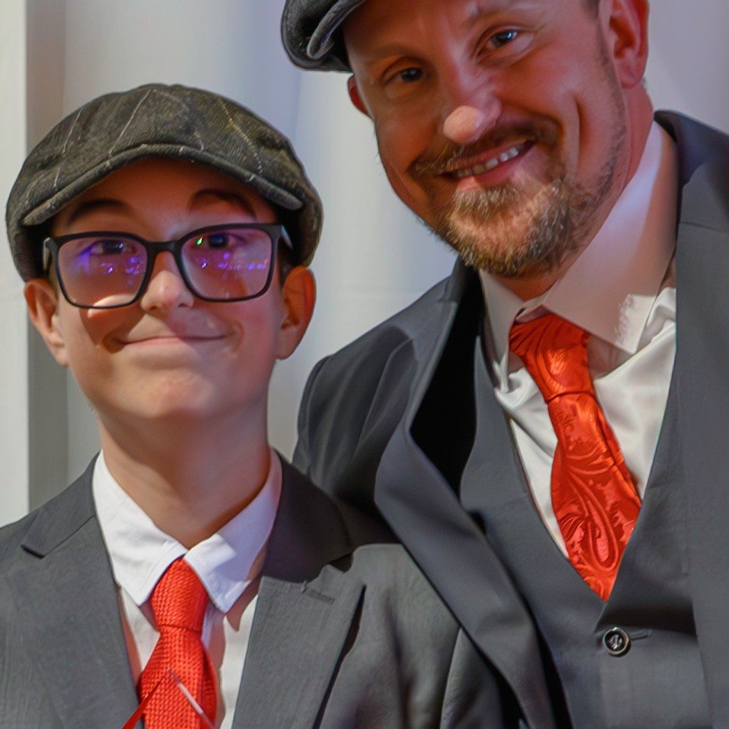boy and father in suits