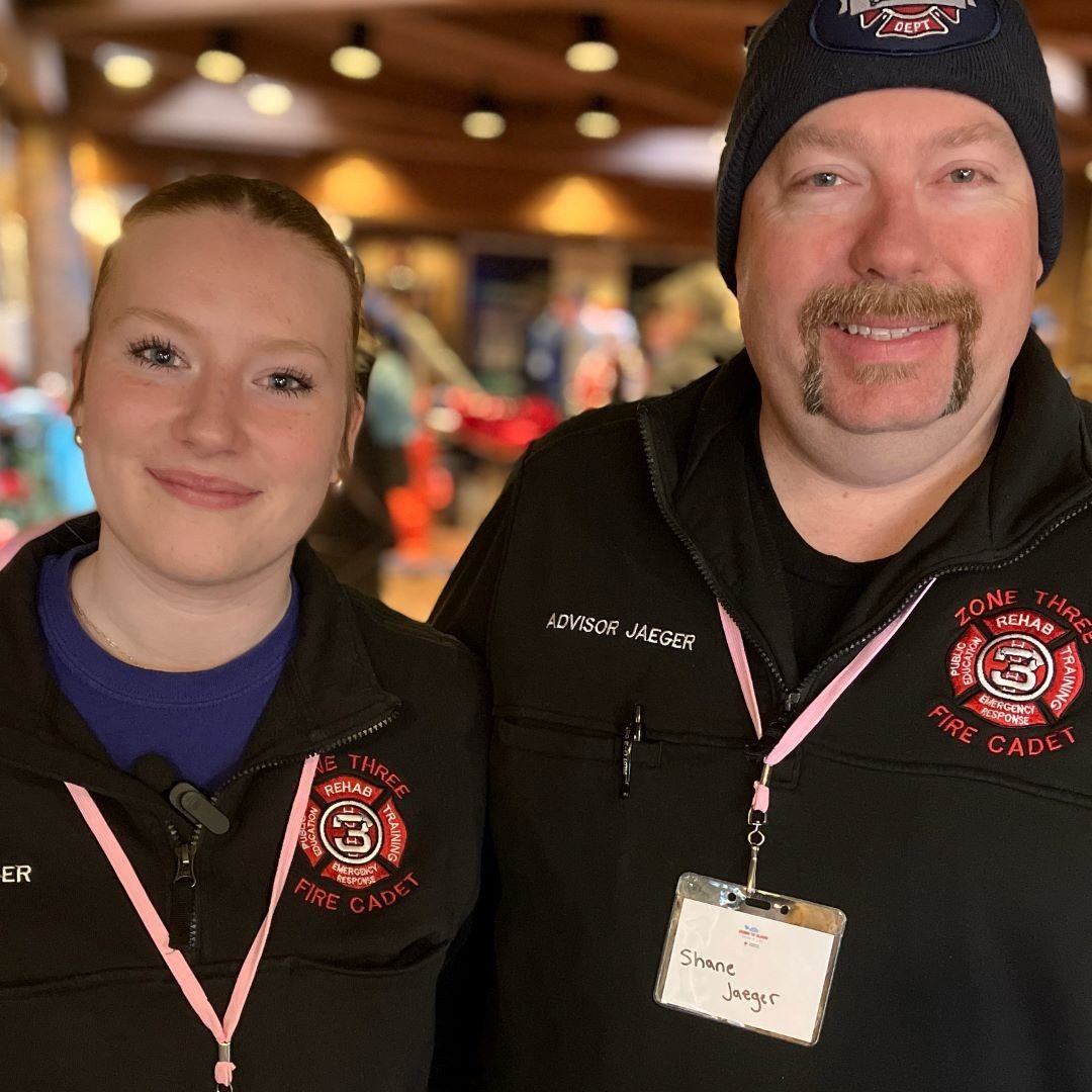 father and daughter smiling at camera