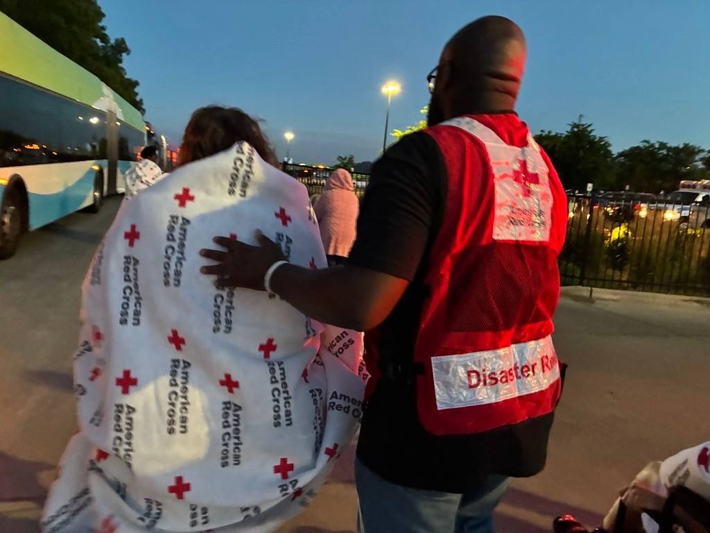 a volunteer helps a client 