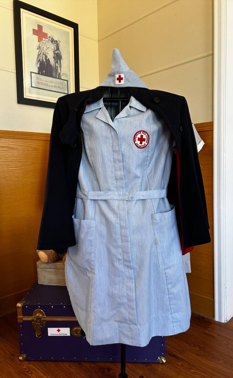 A red cross uniform staged in a corner of the office at Joint Base Lewis Mcchord