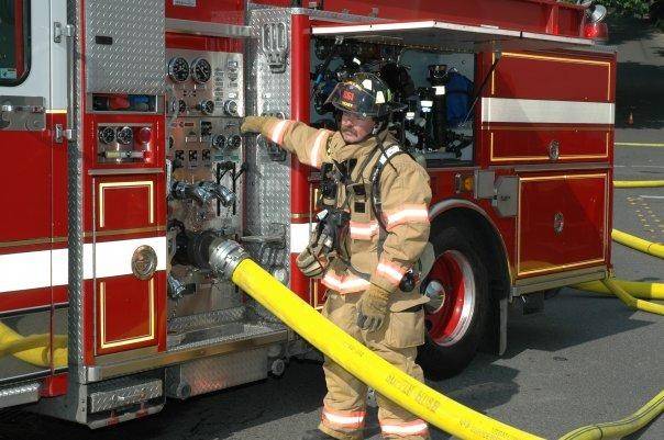 Matt standing alongside a firetruck in Tukwila, WA.