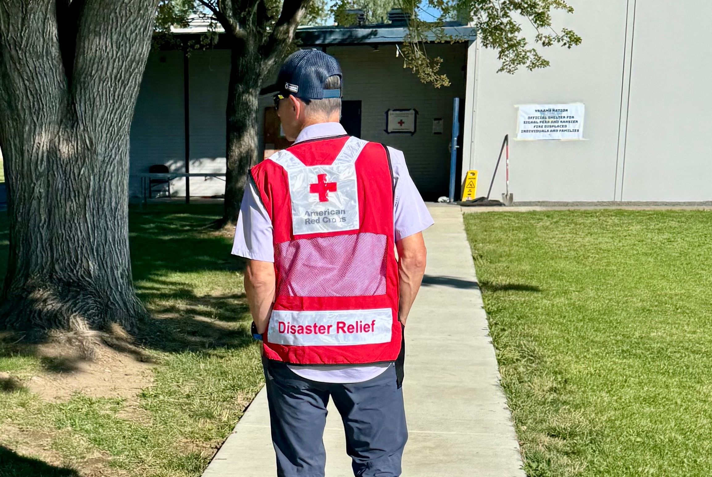 shelter volunteer walking into building