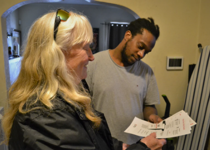 red cross volunteer taking to client