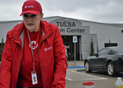 red cross volunteer outside of tulsa center